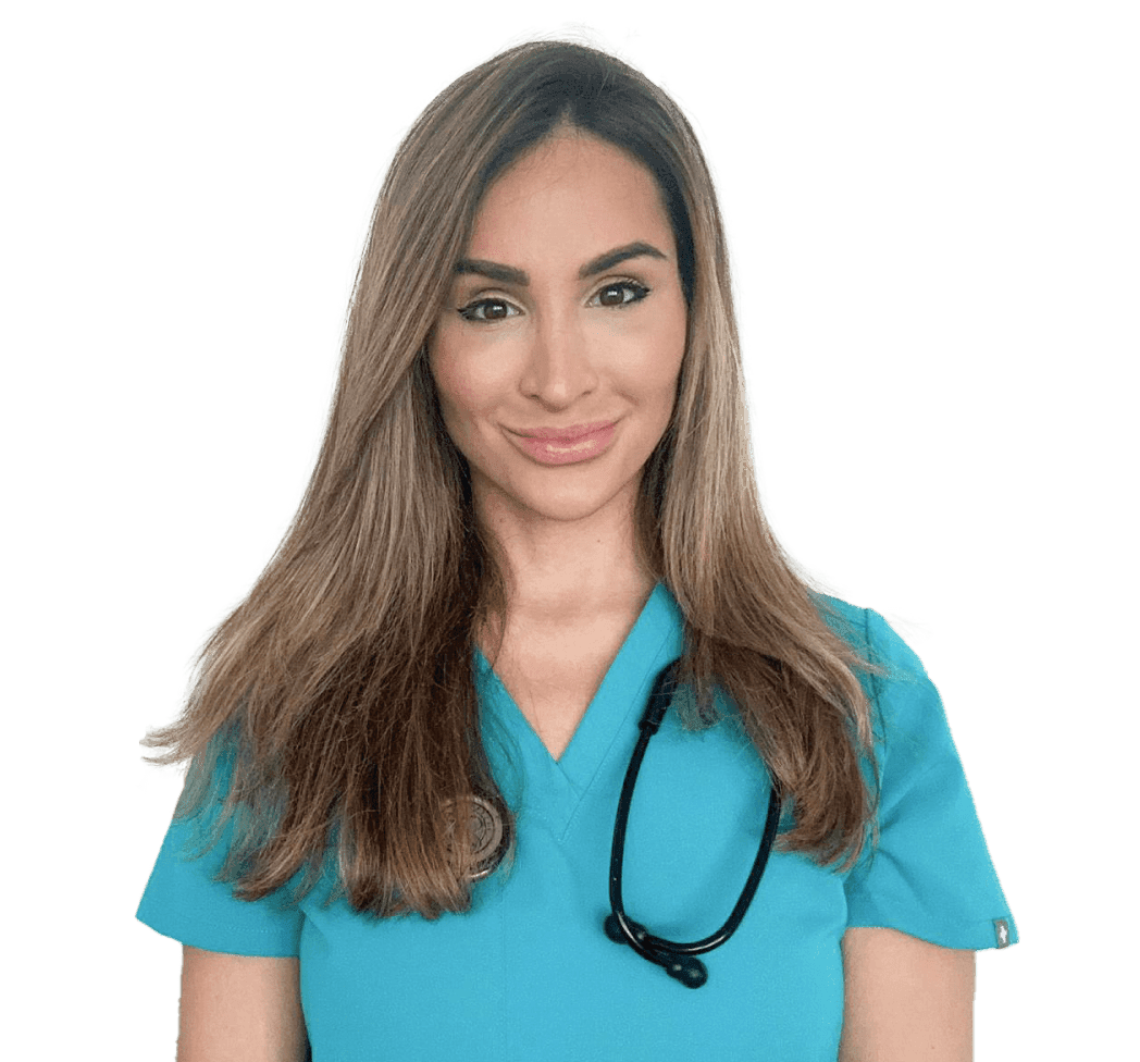 A smiling woman in teal scrubs with a stethoscope around her neck.