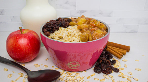 Pink Calicle Insulated Bowl filled with apple raisin oatmeal