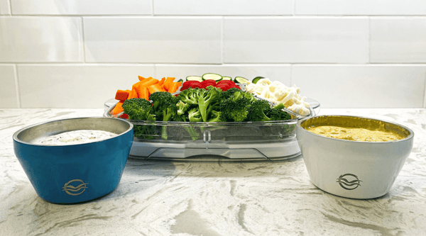 Blue and white Calicle bowls filled with dip with veggies for dipping