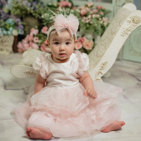 white and pink baptism dress