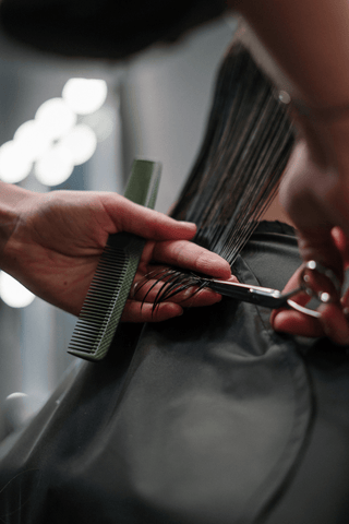 Woman getting a trim at the hairdressers