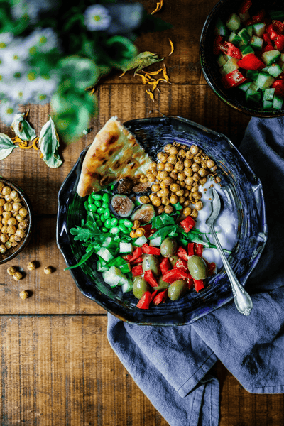 A plate of chickpeas, lentils and iron rich healthy snacks