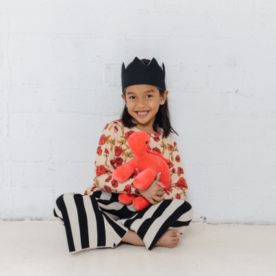 little girl playing and wearing a customizable crown