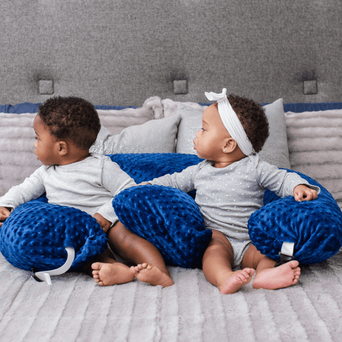 twin z nursing pillow with two babies sitting inside