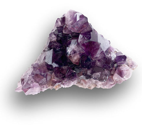 A chunk of amethyst amethyst on a while background with a shadow