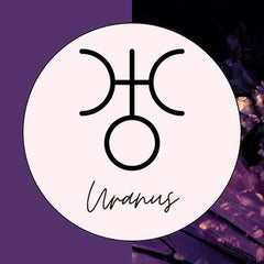 The astrology symbol for the planet Uranus.