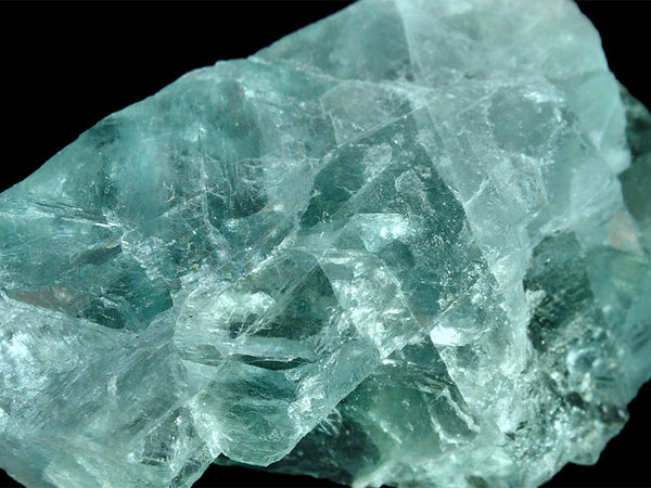 A closeup of mint green Fluorite and it's beautiful textures associated with a positive mindset and emotional level.