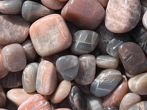 Picture of peach moonstone and gray moonstone that are used to open the crown chakras