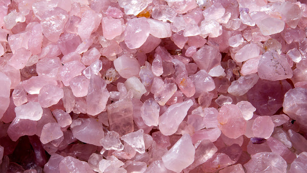 The Rose Quartz meaning spiritually is connected to it's beautiful pink color. Pink crystal tumbled stones are shown.