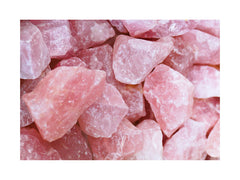 a closeup picture of a pile of rose quartz crystals