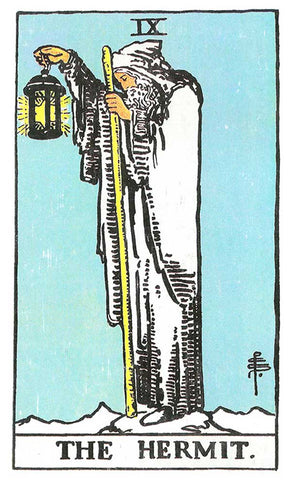 An image of the ninth card of the Major Arcana card sequence in the Rider Waite Smith Tarot Deck. An old man standing on a cliffs edge on a quiet night is doing soul searching walking with a lantern and a staff. 