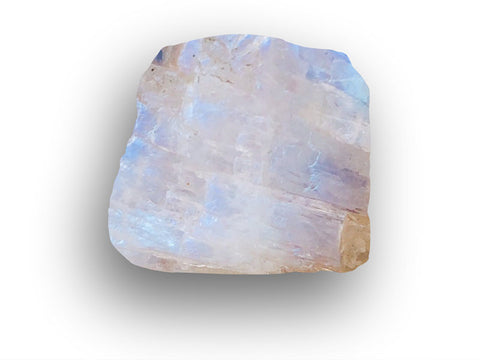 a closeup of raw moonstone, a feldspar mineral, showcasing it's blue adularescence.