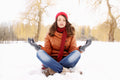 Girl meditating in winter outside