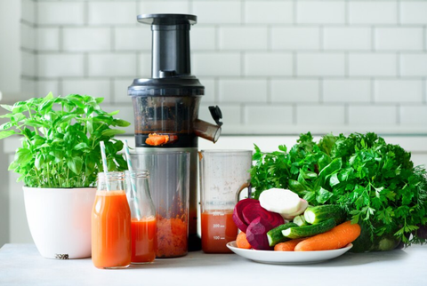Juicer with vegetables and fruit