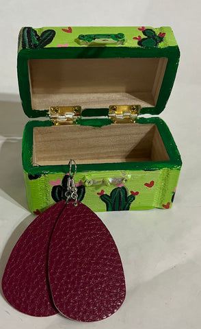 green wood box with a matching earring