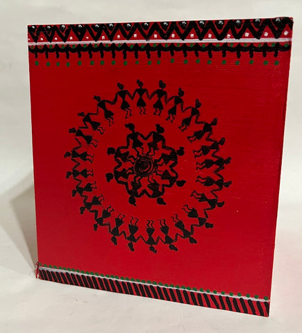 A warli hand painted tissue box cover