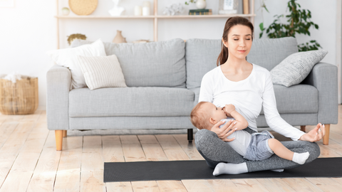 mom meditating while breastfeeding