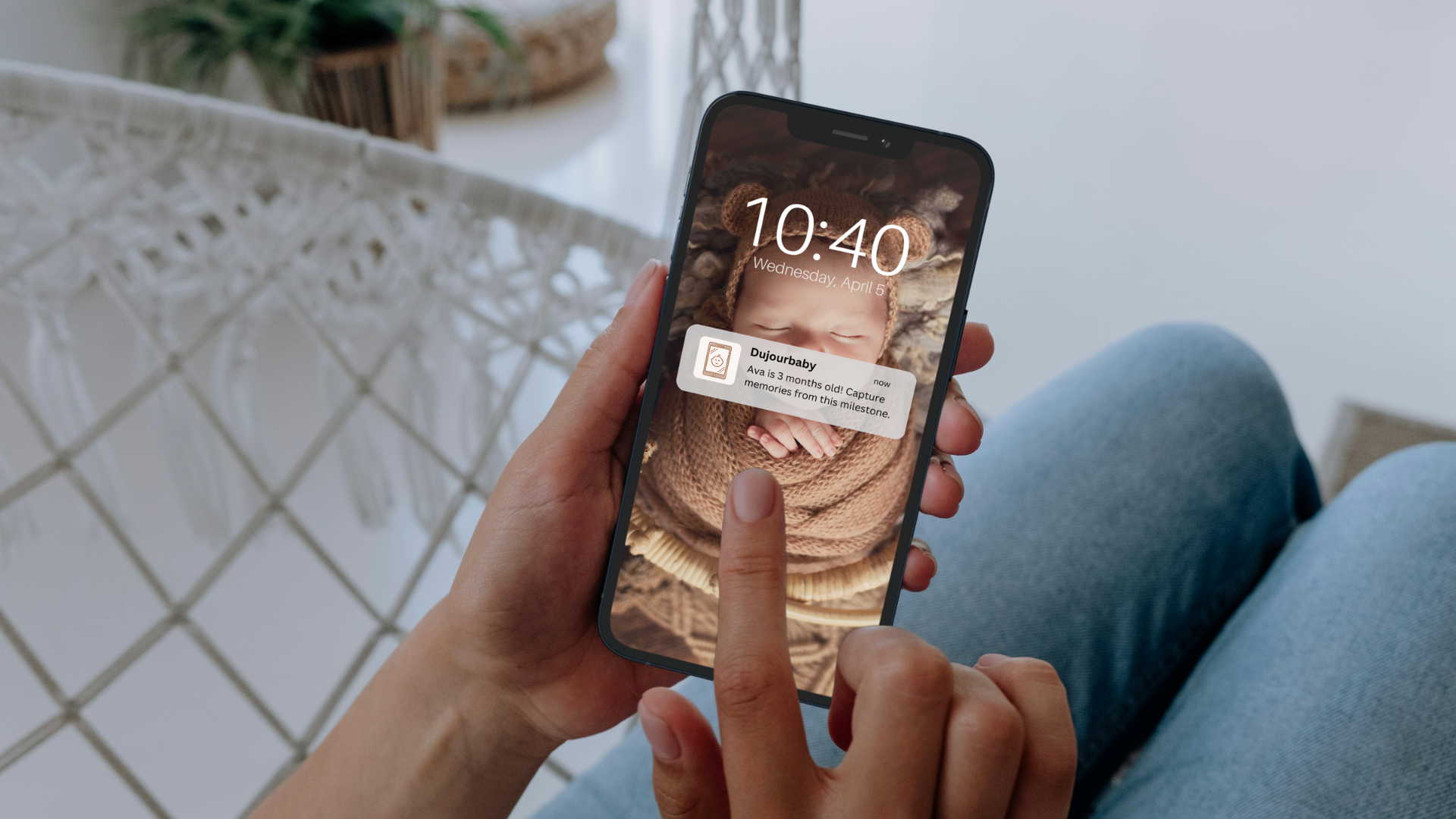 mom getting push notification about baby milestone on phone