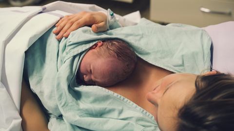 mom meeting newborn for the first time after giving birth