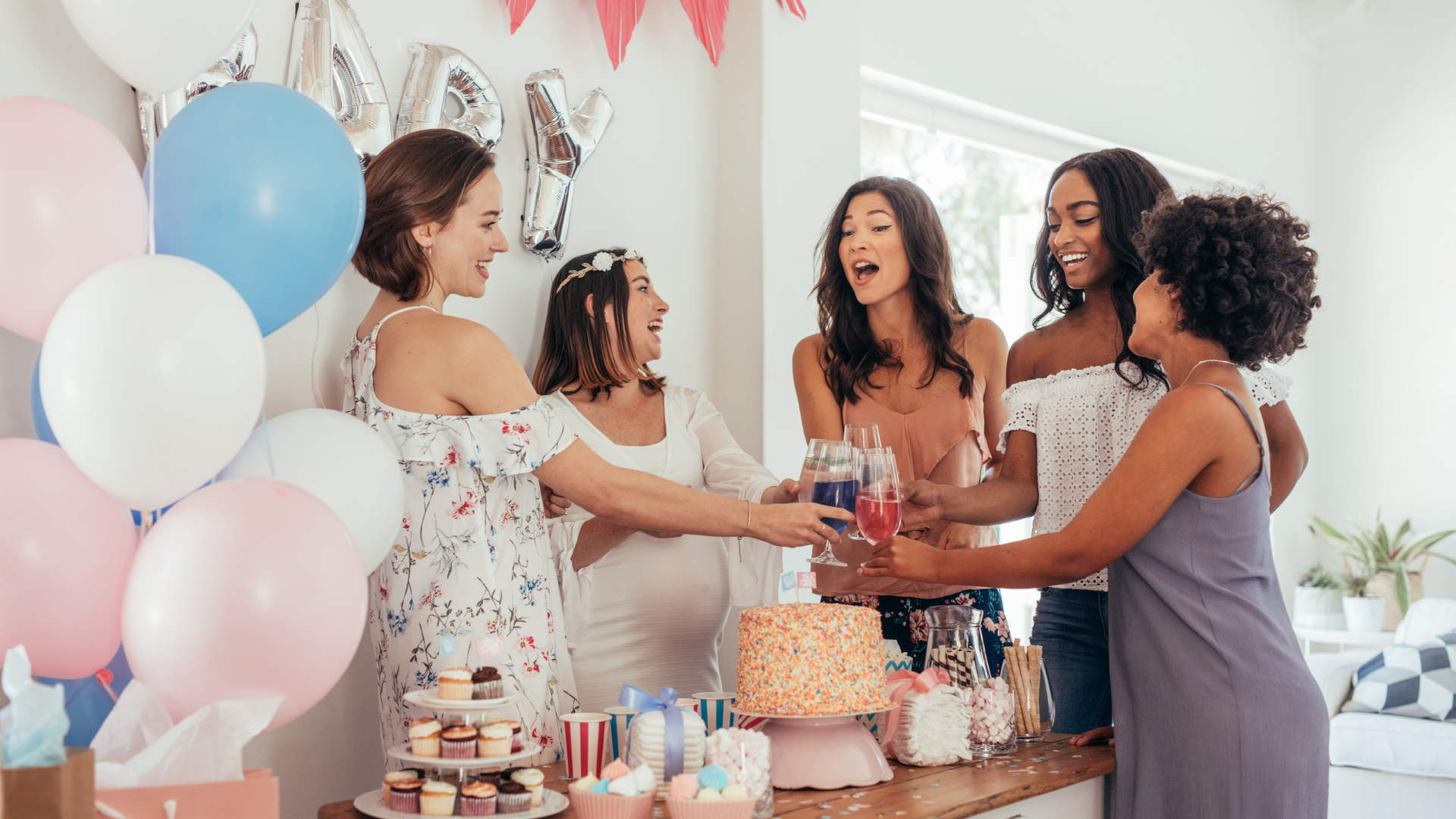 girls at baby shower celebrating friend's pregnancy