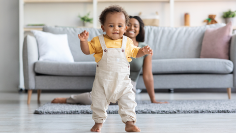 toddler taking first steps