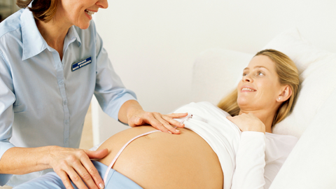 midwife measuring fetal length