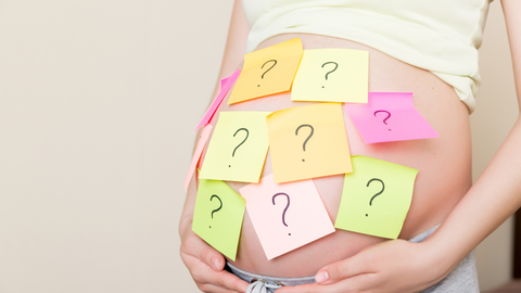 pregnant lady with question marks on belly