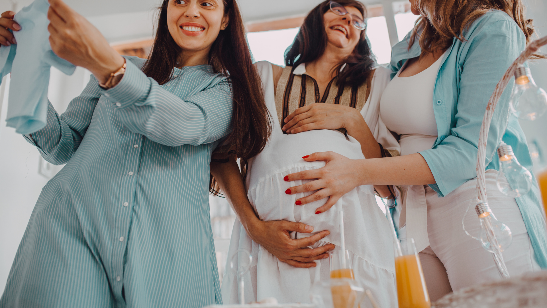 friends celebrating mom to be at baby shower