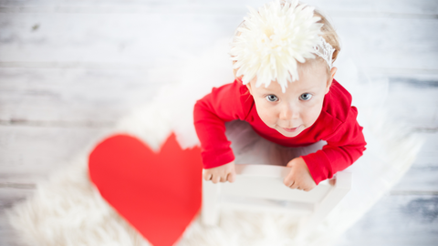 baby crawling on heart mat for valentine's day