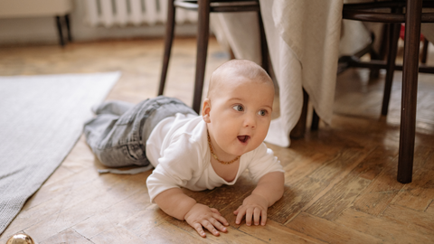baby learning how to crawl