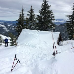 Benson Hut on the ridge of Anderson Peak overlooking Coldstream Canyon and the town of Truckee. 