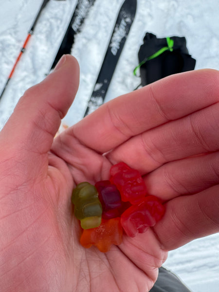 woman holding a handful of gummy bears