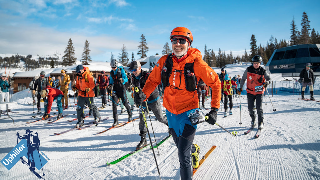 group of people skiing uphill