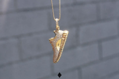 gold and silver shoe necklace