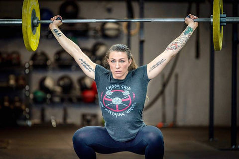 female athlete in a snatch lift position