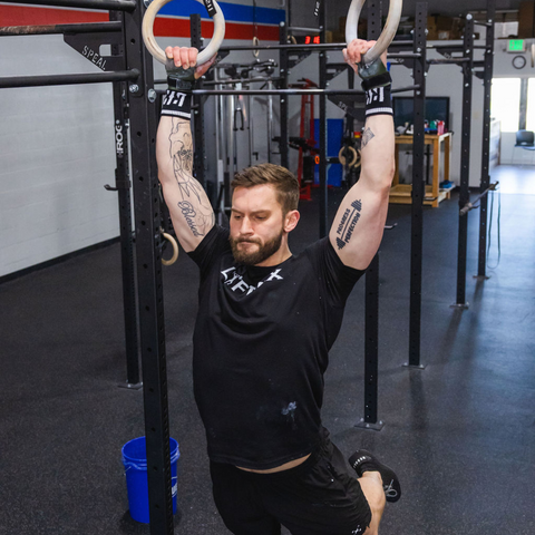 male athlete gymnastic rings workout