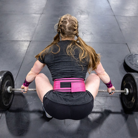female athlete in lifting weights position