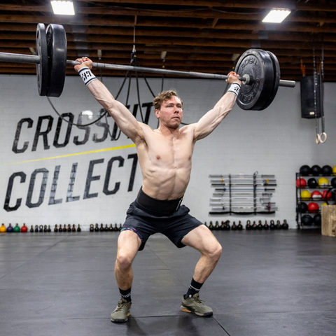 male athlete lifting weights