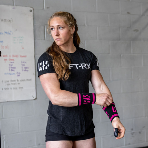 female athlete wearing pink swetbands