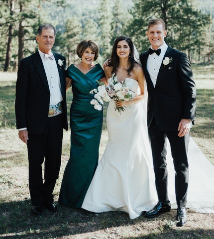mother of the bride with her family in an outdoor setting