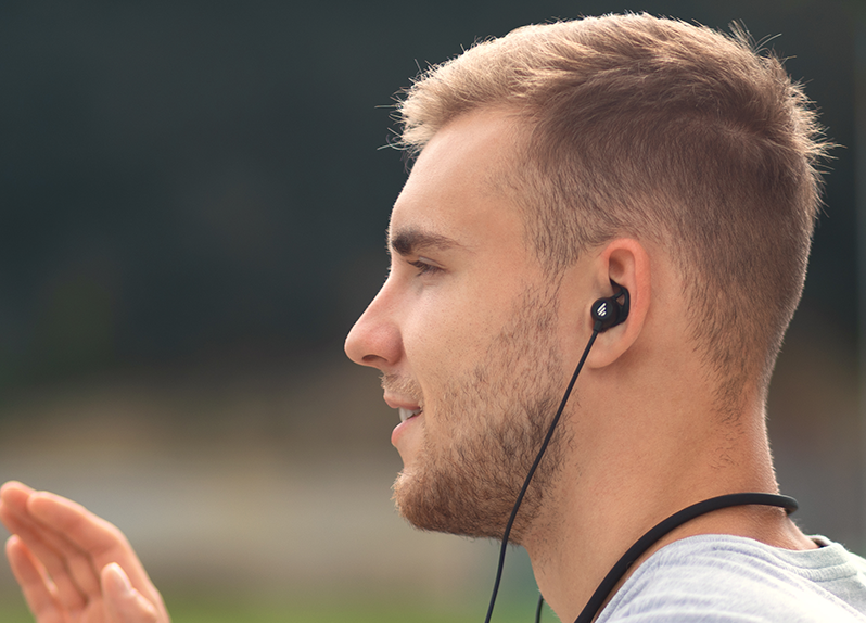 The man wearing EDIFIER W820NB wireless sports headphones