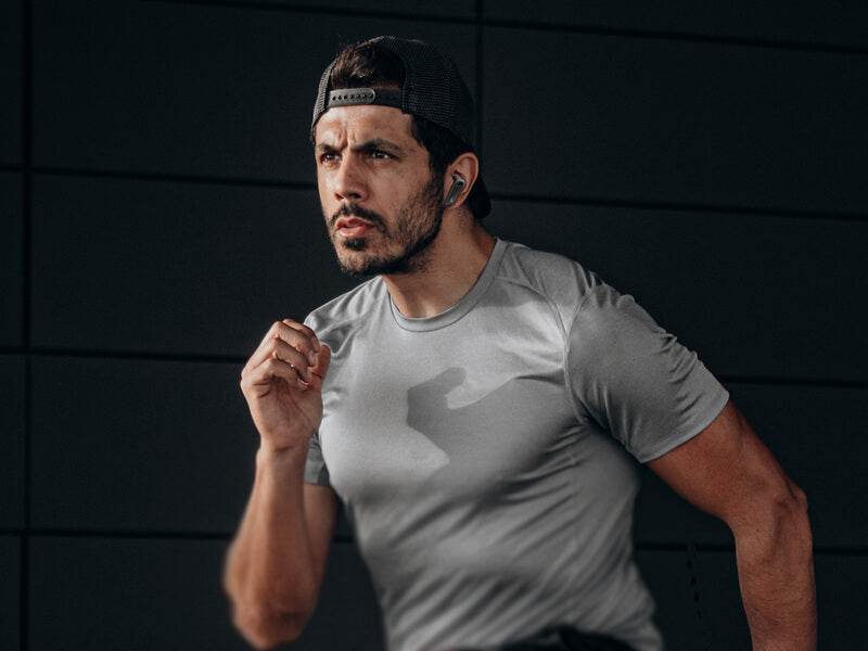 A man is running, wearing edifier neobuds s earbuds