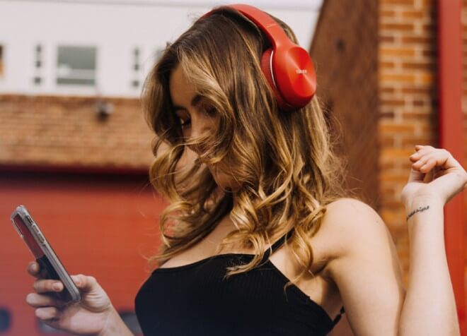 A woman wearing EDIFIER TO-U6+ headphones in the training