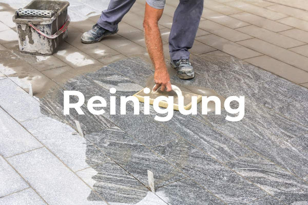 After grouting, tiles are cleaned with a sponge board and water