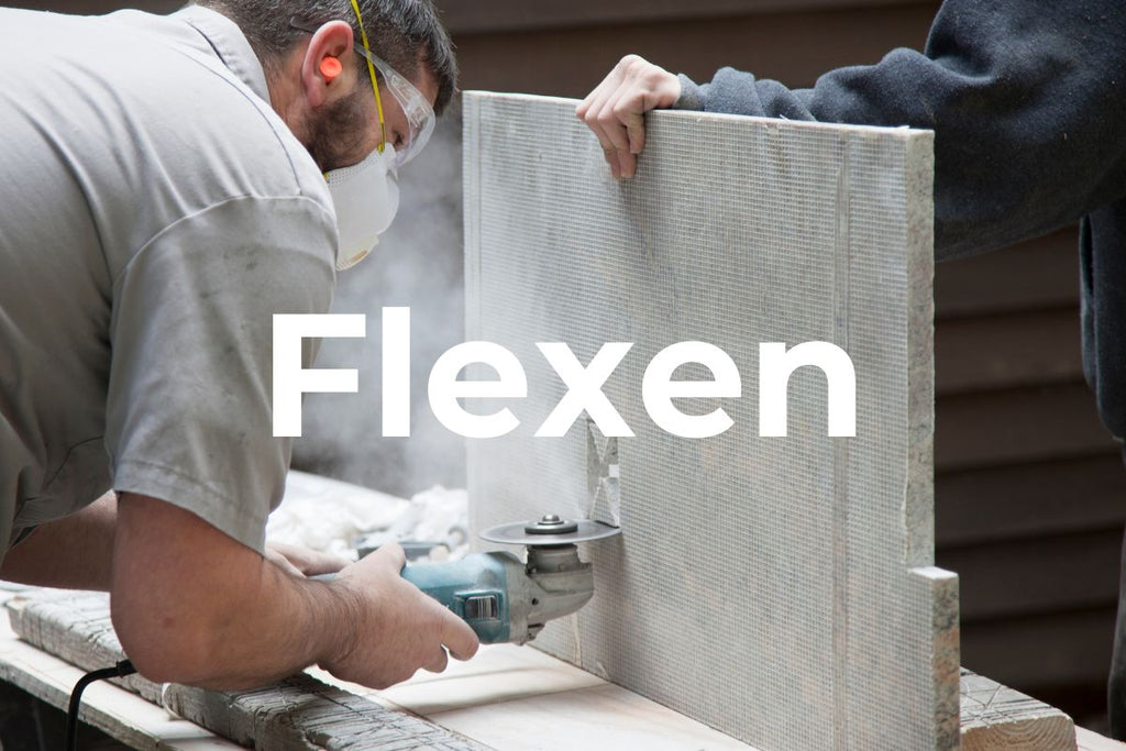 Craftsman cutting granite with a diamond cutting disc and an angle grinder