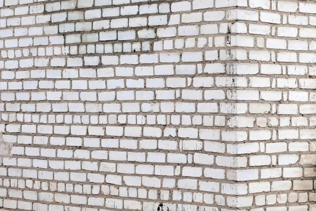 Image d'un mur en briques silico-calcaires avec enduit et mortier à poncer