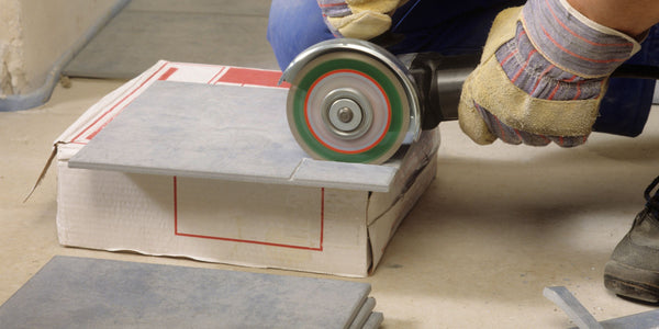 Cut large format tiles with the angle grinder and a diamond tile cutting disc