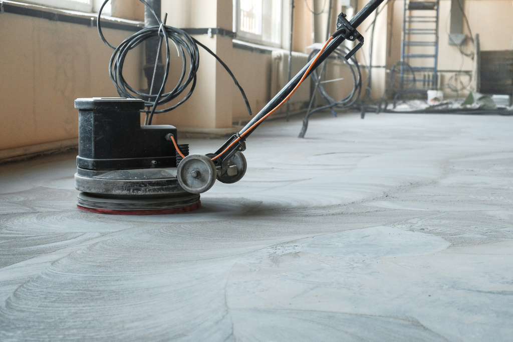 Grind concrete with a floor grinder