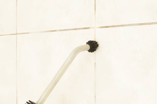 Wall tiles are cleaned with a steam cleaner