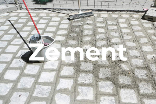 Cement-based grout is used outdoors for a cobblestone driveway